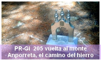 CC by sa 3.0 Eñaut Ramila. Fecha de la fotografía 2017/07/26. A la fotografía se le ha modificado el color y el tamaño y se le ha agregado texto.Información de la ruta de montaña PR-Gi 205 que une el núcleo urbano de Mondragón y la cima de Anporreta. 